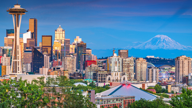 Seattle, Washington, city skyline at dusk with Mount Rainier in the background