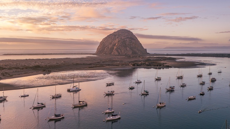 Aerial view of Morro Bay harbor, Morro Rock, and the end of Sandspit Beach