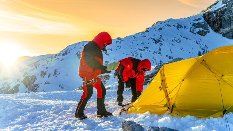 Two climbers camping in the winter