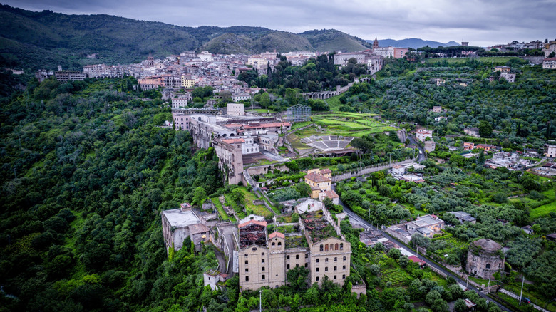 An aerial view of an ancient city surrounded by greenery