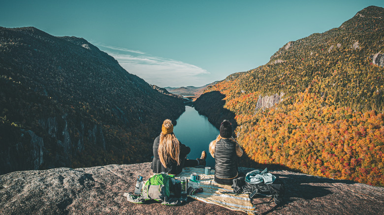 Two people having breakfast at Indianhead in the Adirondacks and overlooking the changing leaves