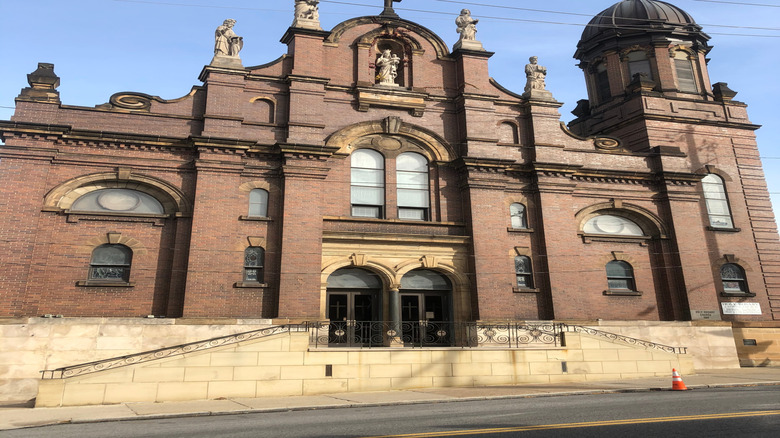 View of the ornate brick facade of the Holy Rosary Church in Cleveland, Ohio on a clear day
