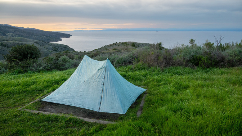 A small tent pitched overlooking the ocean on Santa Cruz Island, part of Channel Islands National Park
