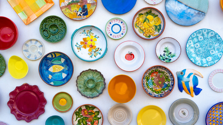 Colorful, traditionally handpainted plates on a white wall in Algarve, Portugal