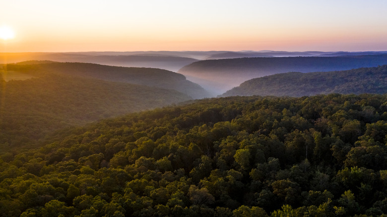 An aerial view of sunrise in the Ozark Mountains