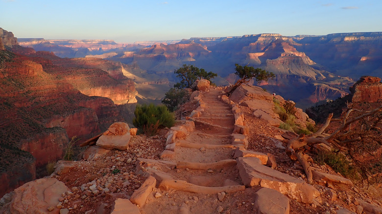 The South Kaibab Trail heading into the Grand Canyon at sunrise