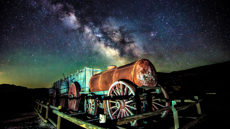 historic train in foreground and mily way in background