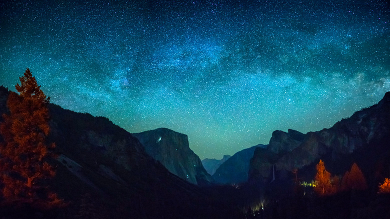 thousands of stars above mountains