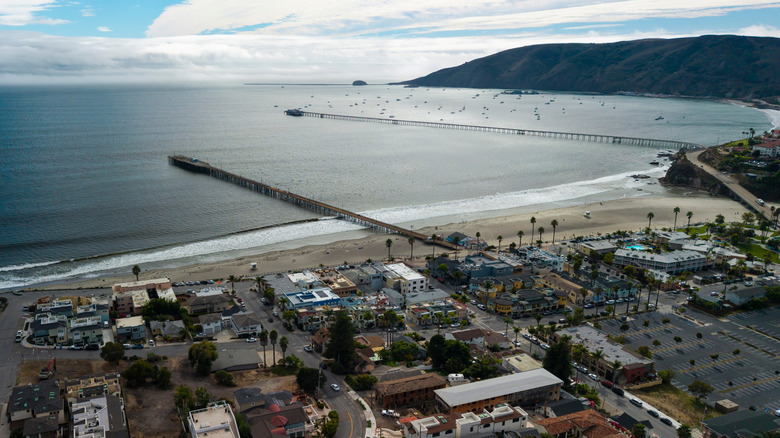A drone photo of Avila Beach, California, and two of the town's boardwalks