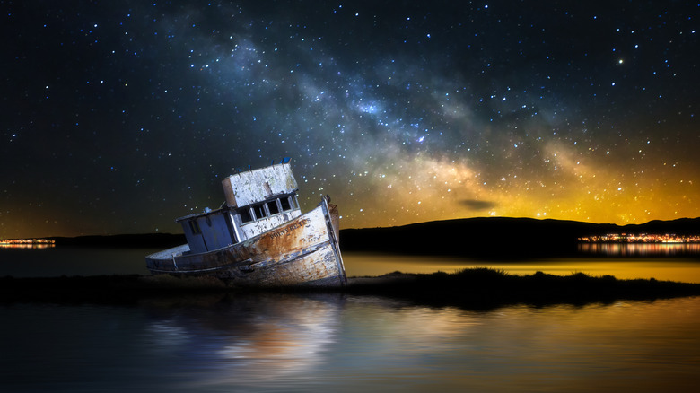 The Point Reyes shipwreck in Tomales Bay under a starry sky in Point Reyes Seashore, California