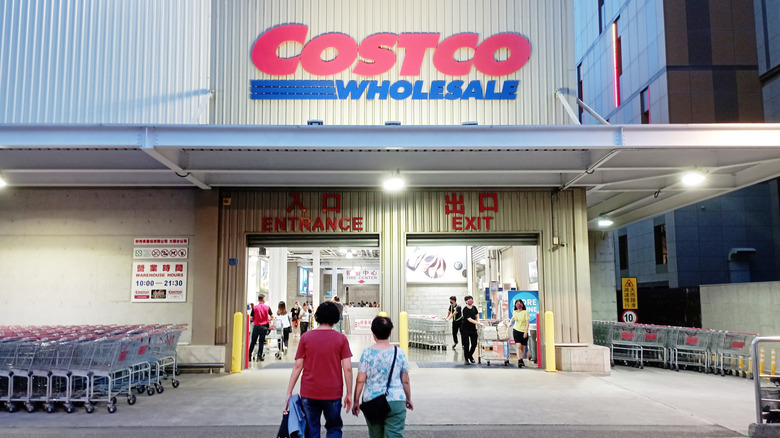 People in front of a Costco warehouse