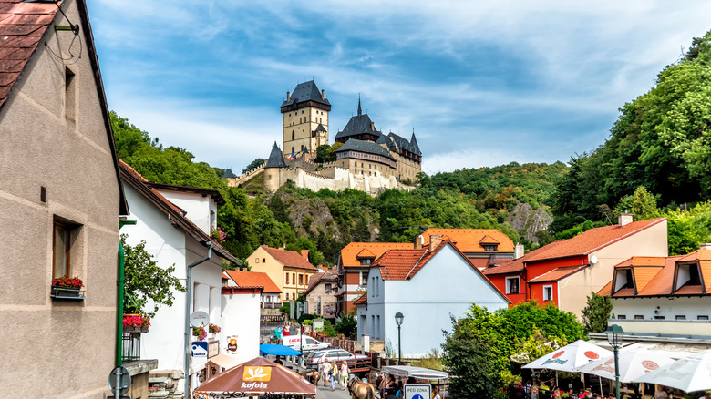 Gothic Karlstejn Castle overlooking a charming small town in the countryside