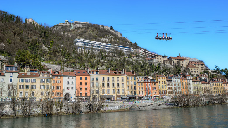 Grenoble cityscape with colorful buildings by the river