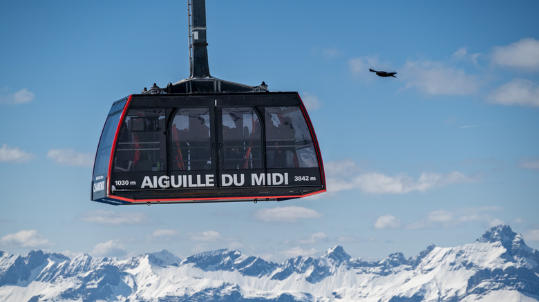 Aiguille du Midi cable car cabin with Alpine peaks in the background
