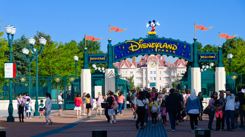 Disneyland Paris entrance gates, with people walking inside
