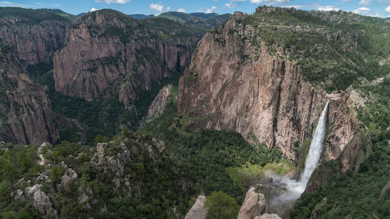 Aerial view of Mexico's Basaseachi Falls within the rugged landscape of Copper Canyon