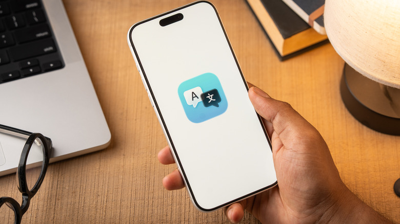The Apple Translate logo on a smartphone