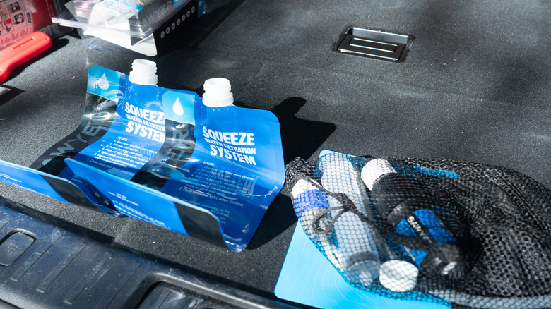 Sawyer Squeeze water filtration system in the back of a vehicle.