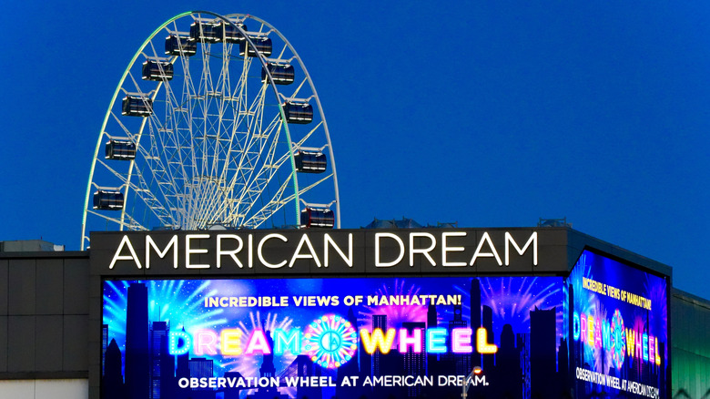 The Dream Wheel at American Dream Mall, with an illuminated sign in front