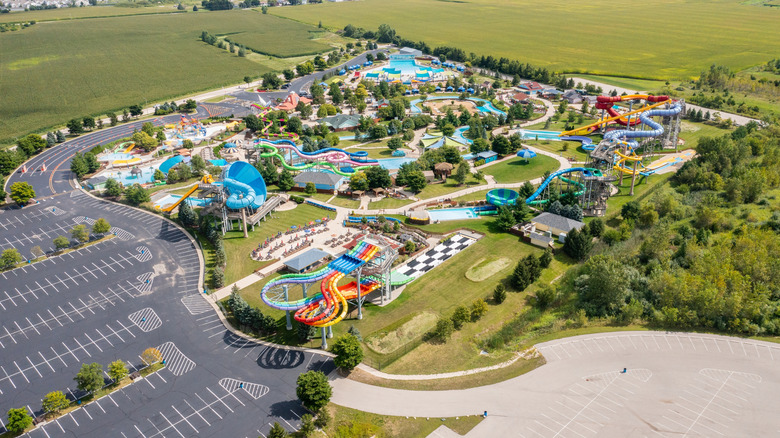 An aerial view of the slides and attractions at Raging Waves water park, surrounded by green fields