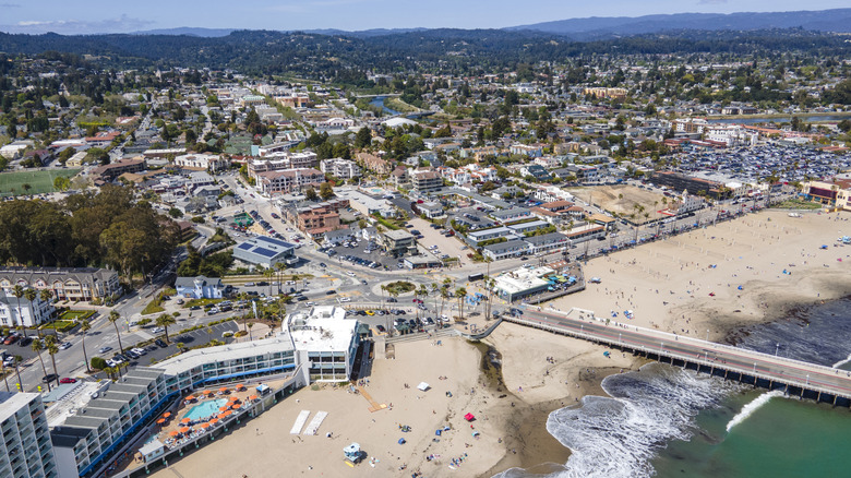 An aerial shot of Santa Cruz, California, with the wharf extending out into the water