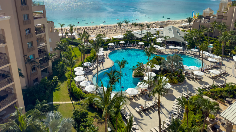 View of the beach and pool from a Ritz-Carlton guest room