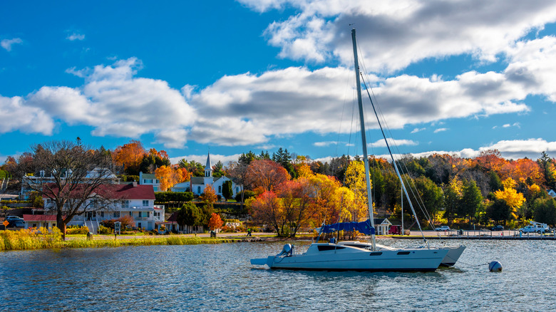 A catamaran and village of Ephraim, Wisconsin, in the background, which sits on Lake Michigan in Door County