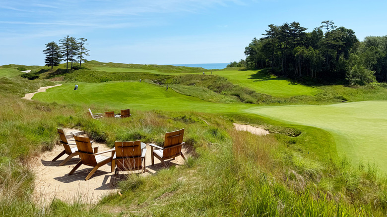 Adirondack chairs and Lake Michigan in the distance at Whistling Straits golf course near Sheboygan, Wisconsin