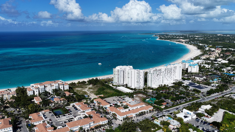 Aerial view of resort hotels and blue water at Grace Bay Beach on Providenciales, the most populous island in the Turks and Caicos archipelago