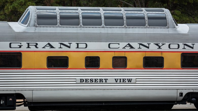 Observation windows on a historic yellow train car of the Grand Canyon Railway, USA