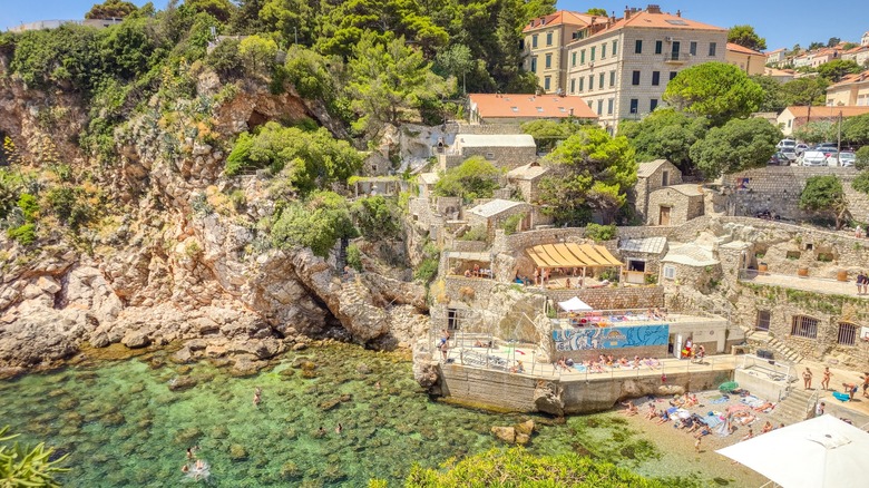 People enjoying the Sulic beach in Kolorina Bay, Dubrovnik