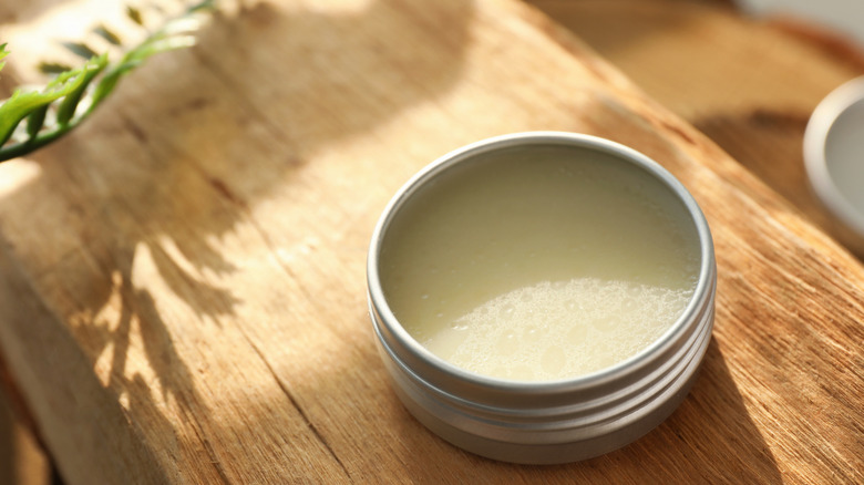 Solid perfume in a round container