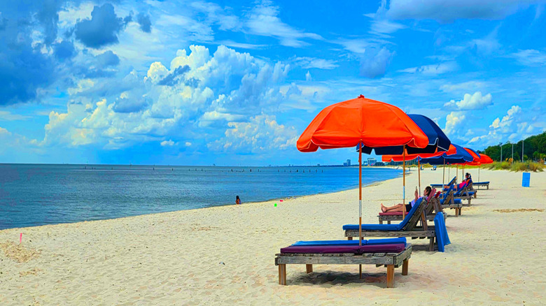 Sunchairs and parasols on the beach in Biloxi, Mississippi