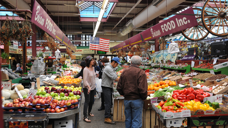 Shoppers browse the Arthur Avenue Retail Market in the Bronx's "Little Italy," NYC