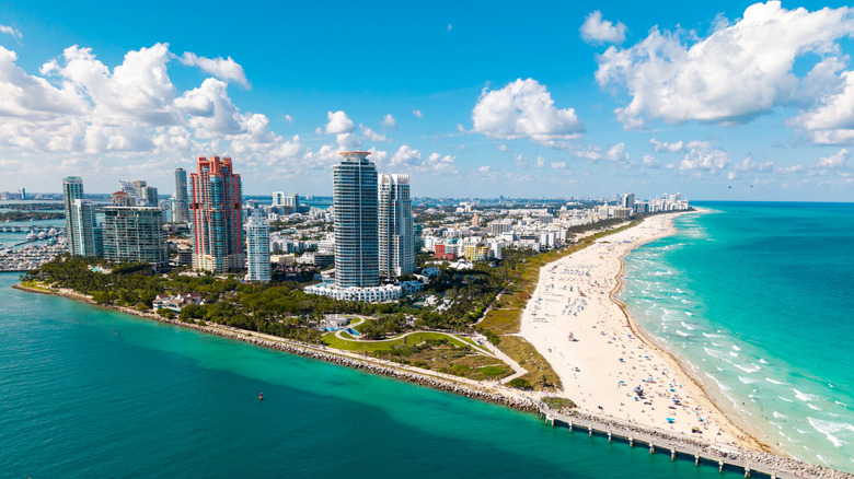 An aerial shot of Miami Beach's coastline dotted with high-rise buildings