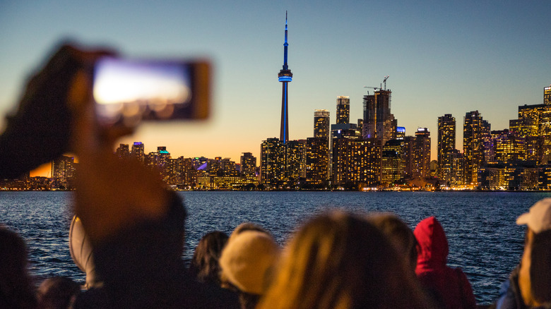 People photographing the beautiful Toronto skyline at night