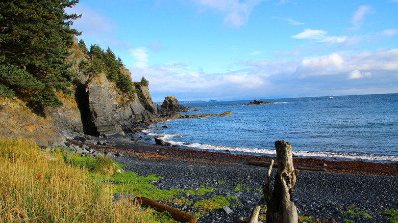 A gravel beach and rocky outcropping on Kodiak Island, Alaska