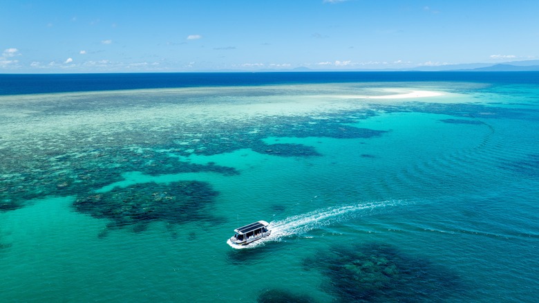 A boat cruises around the Great Barrier Reef in Australia