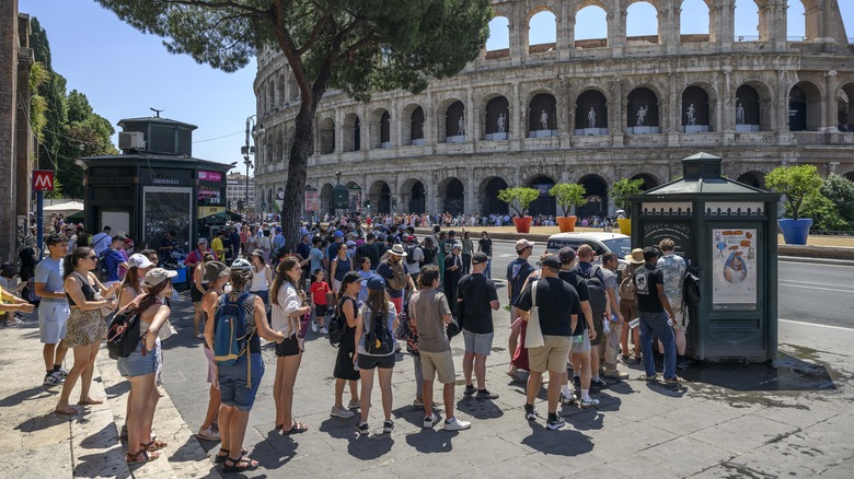 Lines of tourists outside of the Coliseum in Rome