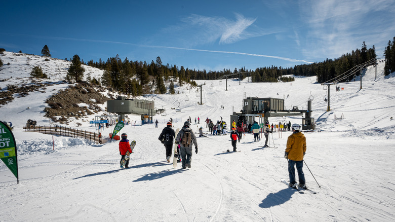 Skiier and snowboarders head toward the J2 and J6 lifts at the family-friendly resort at June Mountain