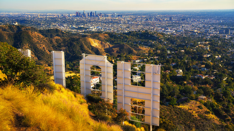 Behind the big white H of L.A.'s iconic Hollywood sign, overlooking the valley and city