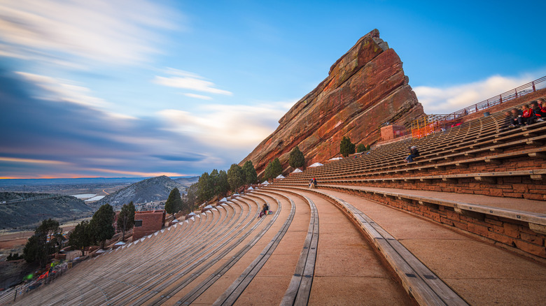 a view of the ampitheater's seating with mountainous landscape in background