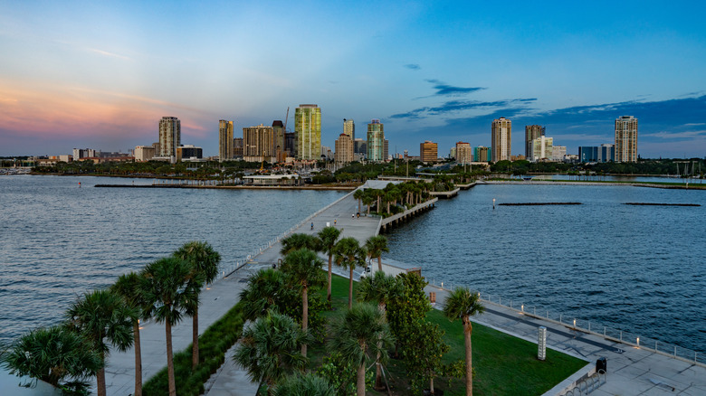 Blue and orange colors mix with the city lights from the pier in St Petersburg Florida.