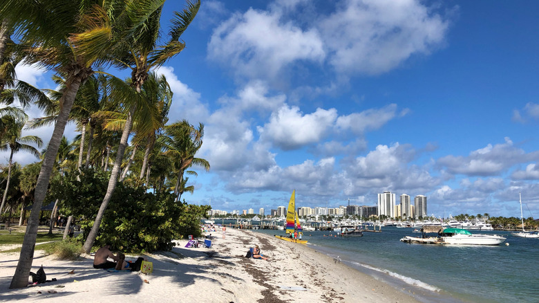 The beach on Peanut Island, Florida, with boats in the water