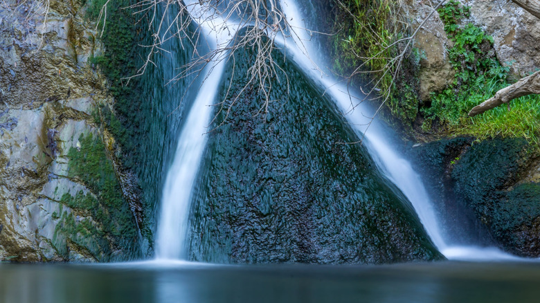 A cascading waterfall flowing through a rocky canyon at Darwin Falls in Death Valley National Park