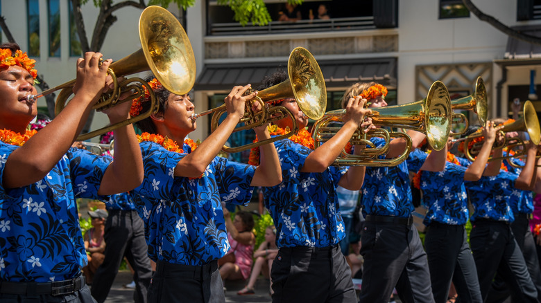Hawaiian trumpeters in leis at Waikiki Holiday Parade