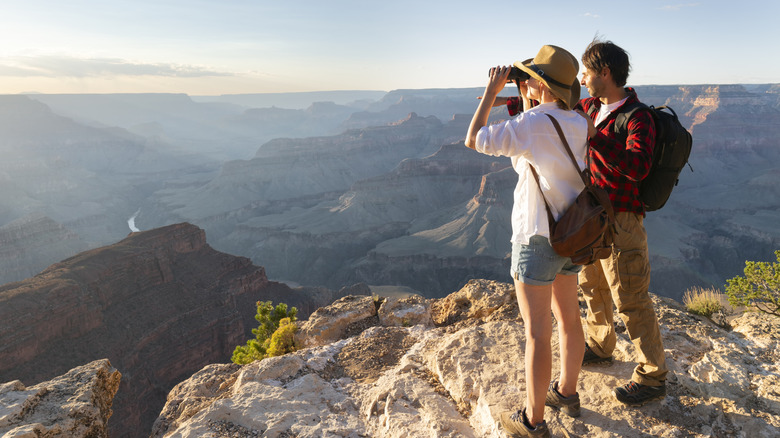 A couple of hikers looking over the Grand Canyon