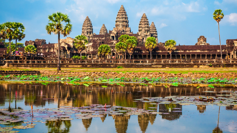 The honeycomb beehive temple of Angkor Wat near a pond, Cambodia