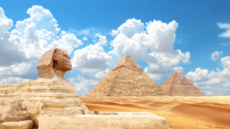The two Pyramids of Giza and the Sphinx under a sunny day