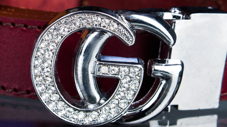 Gucci double 'G' belt, close up of a diamond encrusted buckle